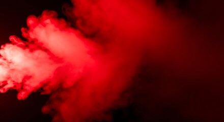 Abstract red smoke effect on black background creating a fiery texture