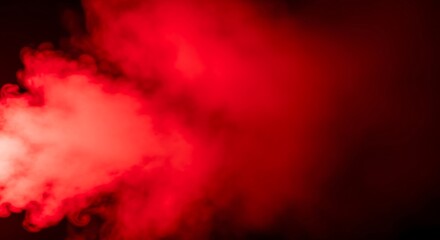 Vibrant Red Smoke Plumes Flowing Across a Dark Backdrop Creating an Abstract Texture