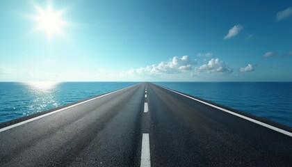 Fototapeta premium Asphalt road leads to ocean horizon under bright sunny sky with clouds. Endless blue water reflects sunlight. This image evokes travel adventure and freedom.