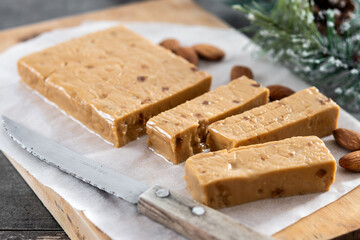Christmas soft almond nougat bar on wooden table