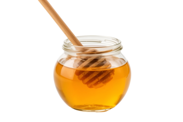 Glass jar filled with golden honey and wooden dipper isolated on a transparent background