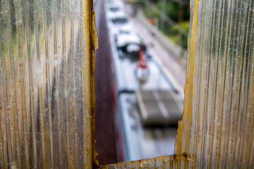 Train is seen through a window with a blurry background