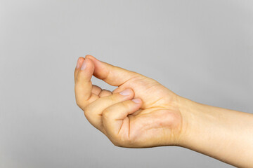 The three fingers folded gesture