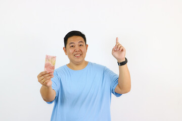 Smiling man holding money offering cash financial concept