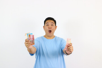 Asian Man with Indonesian Rupiah pointing finger with excitement gesture