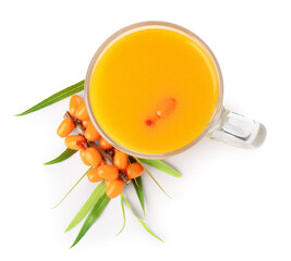 Cup of sea buckthorn tea and fresh berries isolated on white, top view