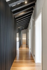 Narrow interior hallway, vertical wood wall, wood ceiling beams, long view, white walls, doors