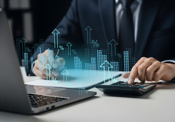 Real estate financial planning for business growth and efficiency, Laptop and calculator with digital charts and rising arrows
