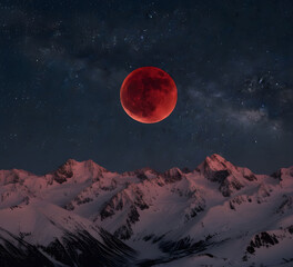 A Majestic Lunar Eclipse Over a Mountain Vista