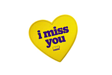 A golden yellow heart-shaped design with purple text reading "i miss you", isolated on black