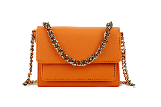 A vibrant orange shoulder bag with a gold chain strap set against a black background