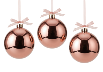 Three rose gold Christmas baubles isolated on transparent background, festive holiday ornaments for seasonal decoration