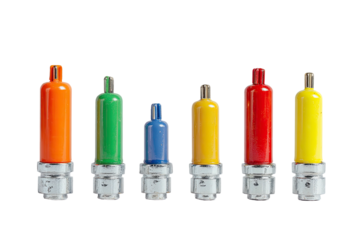 Array of colorful, tubular objects with metallic bases, against a stark black background