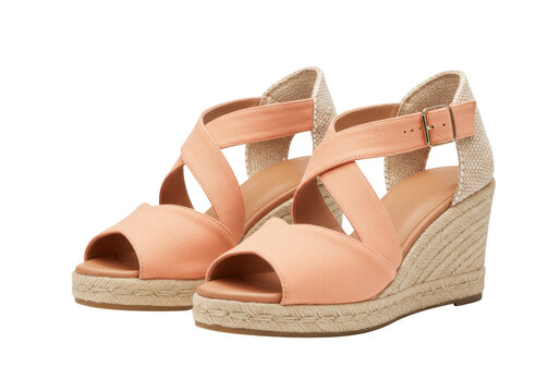 Peach-colored espadrille wedge sandals isolated on a clean background, stylish summer footwear for women fashion and vacation