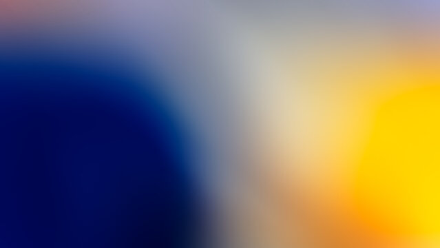 Abstract blurred gradient background with blue and yellow spots.