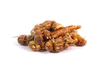 Fresh kencur rhizomes (Kaempferia galanga), also known as aromatic ginger, isolated on a white background. An important spice and herb in traditional Indonesian and Asian cuisine.