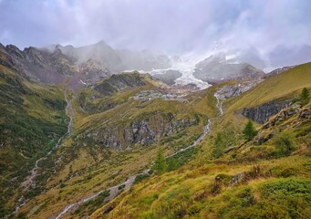 Monte Rosa (Italy) - A mountains view in Valsesia with Monte Rosa mount peak of Alps, alpinistic paths to Rifugio Modena and Capanna Margherita refuge, with snow glacier and alpinists.