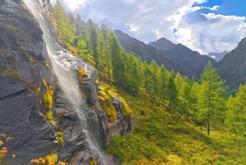 Monte Rosa (Italy) - A mountains view in Valsesia with Monte Rosa mount peak of Alps, alpinistic paths to Rifugio Modena and Capanna Margherita refuge, with snow glacier and alpinists.