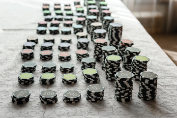 Casino chips on the table. Coins for board games.