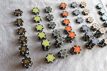 Casino chips on the table. Coins for board games.