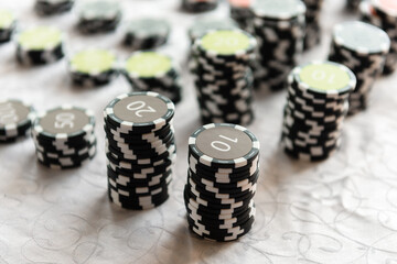 Casino chips on the table. Coins for board games.