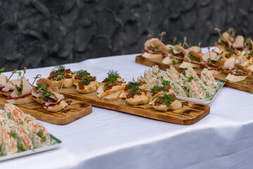 Food on the festive table. Cold appetizers for the banquet.