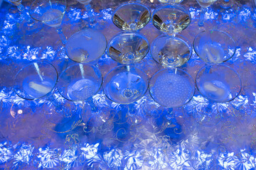 Lots of champagne glasses, alcohol bubbles. A fun drinking party.