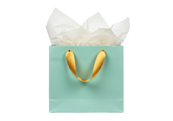 Elegant light blue gift bag with gold ribbon handles isolated, filled with white tissue paper for birthdays and special occasions