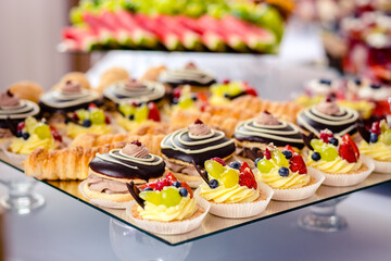 Dessert buffet or candy bar during catering event, fruits and whipped cream
