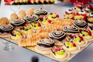 Dessert buffet or candy bar during catering event, fruits and whipped cream