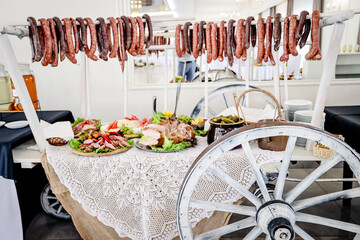 full table of sausage and ham, wedding food in restaurant