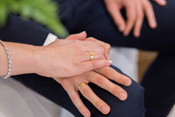 A bride and groom are holding hands