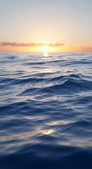 Serene ocean waves at sunset with golden sun reflecting on the waters surface, creating a tranquil and peaceful atmosphere