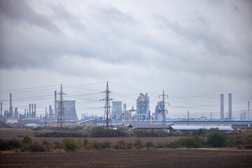 Obraz premium industrial landscape with factory on rainy autumn day