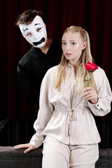 A pantomime scene between two actors expressing the emotion of fear. Close-up.