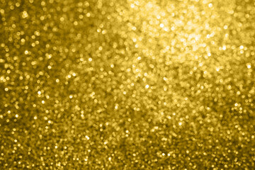 Abstract gold glitter sparkle texture with bokeh background
