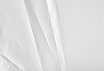 Obraz premium New blank white paper sheet, folded and wrinkled background and texture