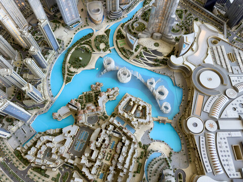 Aerial of Dubai downtown with Dubai fountains, palace hotel and Emaar community high rise buildings, real estate background drone view 