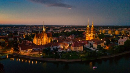 Evening Panorama of Wrocław – Aerial View of Ostrów Tumski with Illuminated Street Lamps