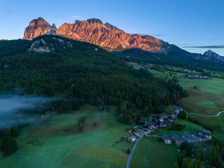 Cortina d' Ampezzo in Italian Alps, Winter Olympics in Italy, winter skiing resort in the Dolomites, Cima Tofana di Mezzo. Autumn morning mountain forest. Beautiful meadow in the Italian Alps . 