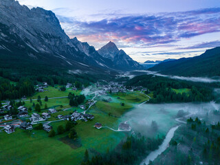 Cortina d' Ampezzo in Italian Alps, Winter Olympics in Italy, winter skiing resort in the Dolomites, Cima Tofana di Mezzo. Autumn morning mountain forest. Beautiful meadow in the Italian Alps . 