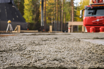 Fototapeta premium Fresh concrete foundation slab casting at building site