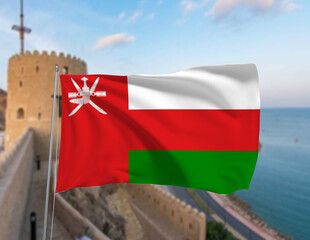 The Oman national flag waving in front of a historic fort with the coastline in the background, showcasing a blend of tradition, culture, and modern patriotism. Represents Oman’s heritage and pride.