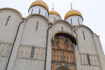 The cathedral with golden domes on the territory of the Moscow Kremlin. Temples of the Moscow Kremlin. The architectural ensemble of Cathedral Square. Culture and heritage in architecture.