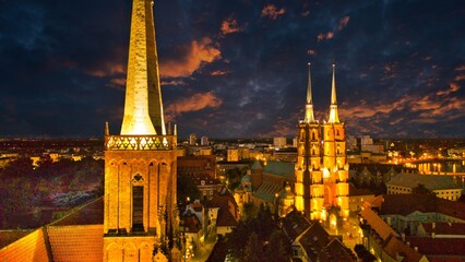 Evening Panorama of Wrocław – Aerial View of Ostrów Tumski with Illuminated Street Lamps