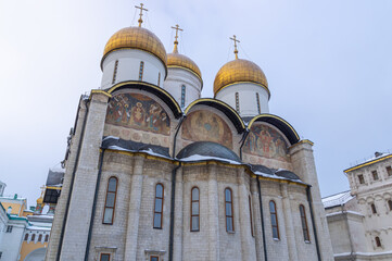 The cathedral with golden domes on the territory of the Moscow Kremlin. Temples of the Moscow Kremlin. The architectural ensemble of Cathedral Square. Culture and heritage in architecture.