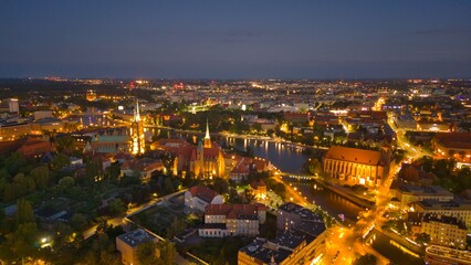 Evening Panorama of Wrocław – Aerial View of Ostrów Tumski with Illuminated Street Lamps