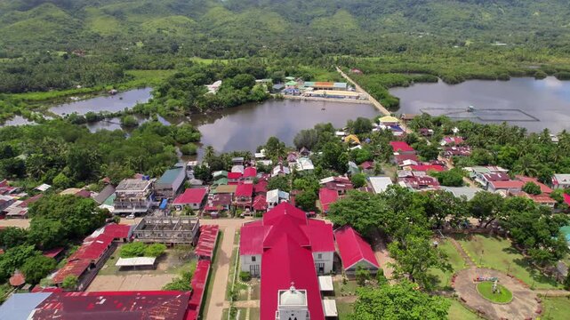 4k Drone Footage of Anda Church, Bohol, Philippines. Hoovering forward, showcasing the church and town. 