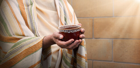 Ola man gilding a cup