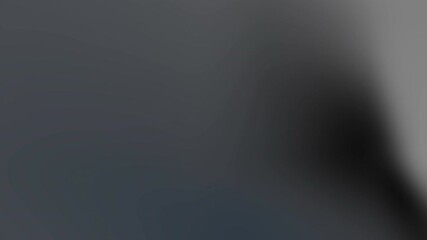 Dim, out-of-focus scene in a muted room, shadowy figure near a wall, soft grayscale tones. gloomier